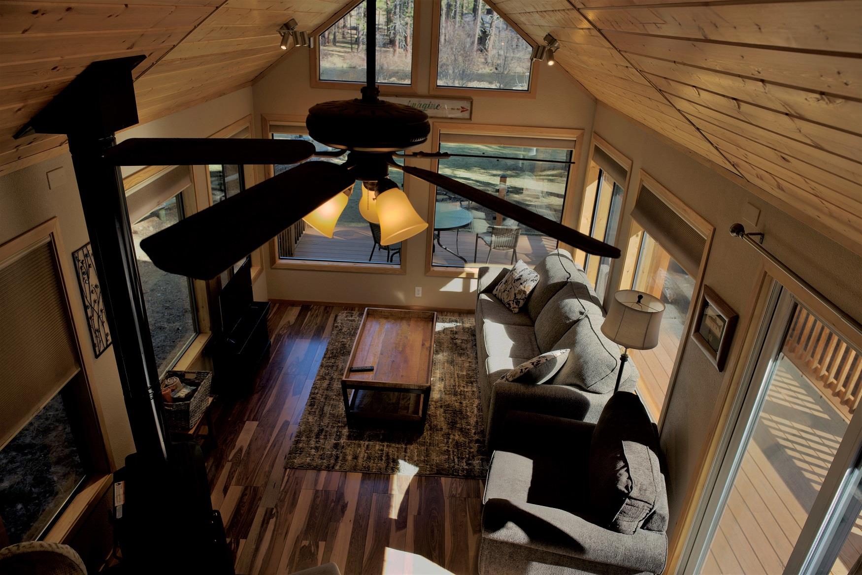 The cozy living room of Riverview Cabin at Cold Springs Resort & RV Park in Camp Sherman, Oregon